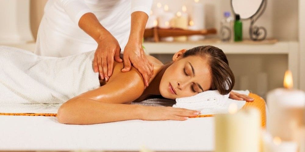 Woman receiving a massage at a massage studio.