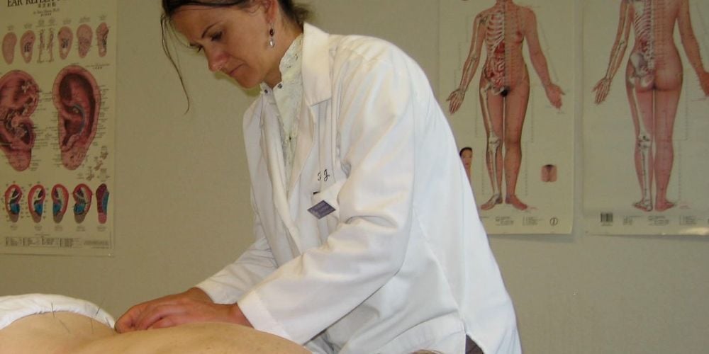 Acupuncturist at work.